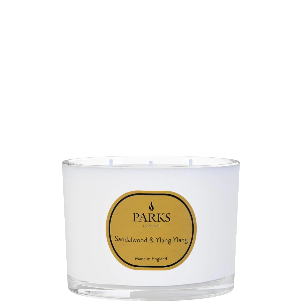 A white, round 3-wick candle with a label that reads 'PARKS Sandalwood & Ylang Ylang. Made in England.'
