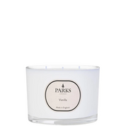 A white, round 3-wick candle with a label that reads 'PARKS Vanilla'.