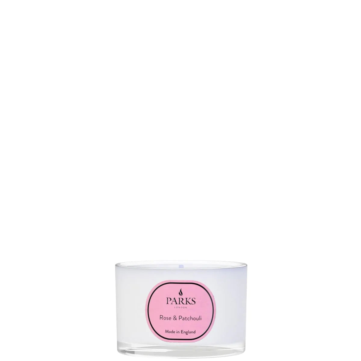 A white travel candle with a label that reads 'ROSE & PATCHOULI' and the brand 'PARKS'.