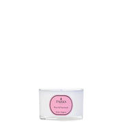 A white travel candle with a label that reads 'ROSE & PATCHOULI' and the brand 'PARKS'.