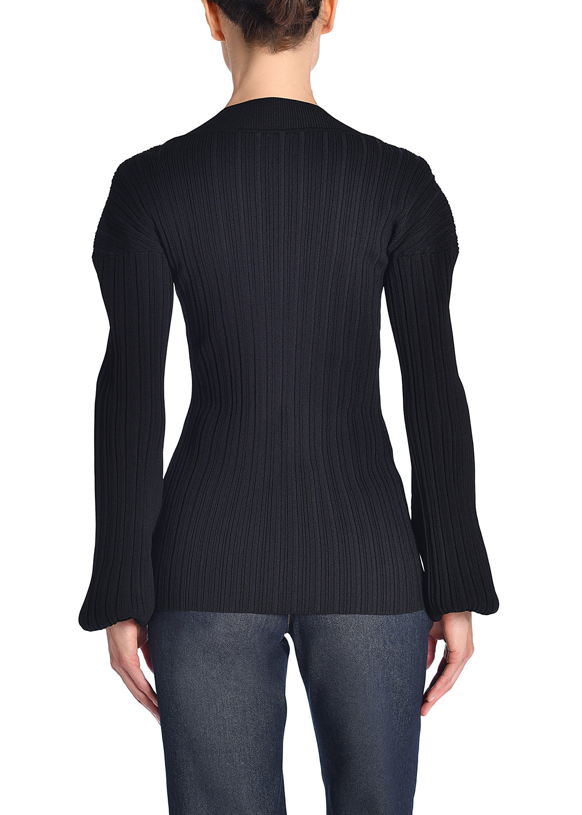 A back-facing image of a model wearing a black knit shirt