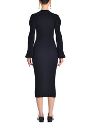 A back-facing image of a model wearing a black midi dress. 