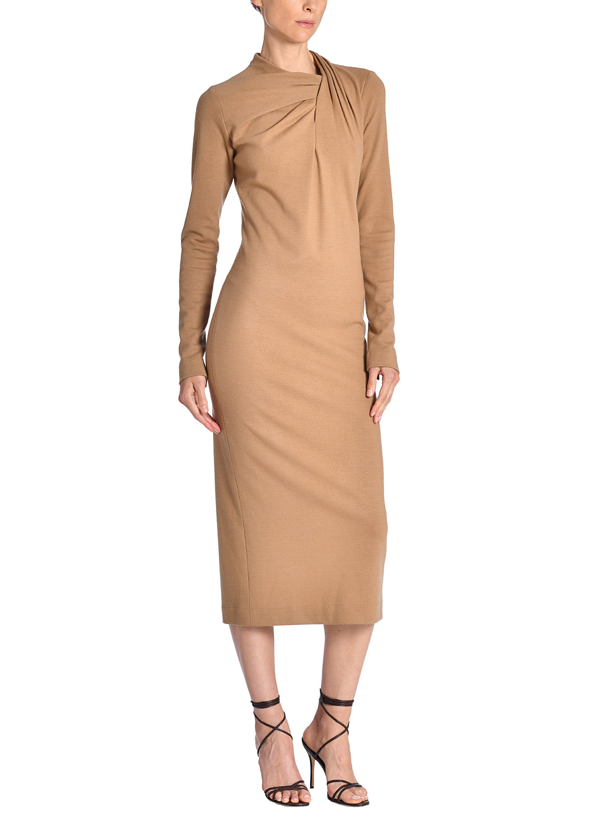 A side-facing image of a model wearing a camel midi dress. 