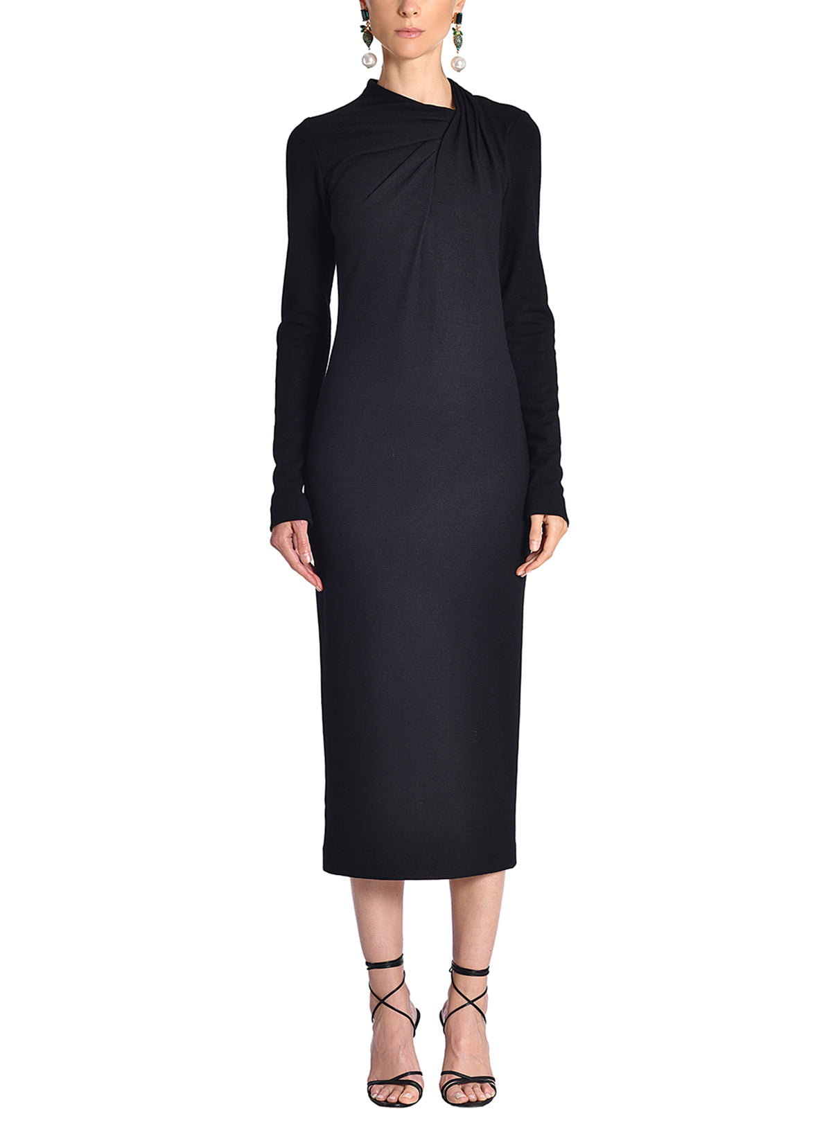 A front-facing image of a model wearing a black midi dress. 