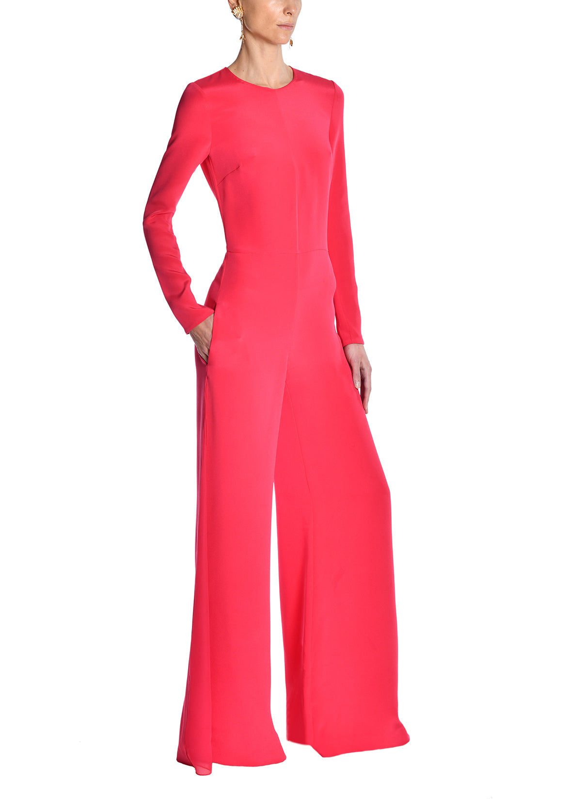 A model wearing a pink jumpsuit.