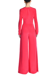 A model wearing a pink jumpsuit. 