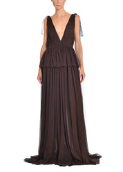 An image of a model wearing a mocha brown silk gown. 