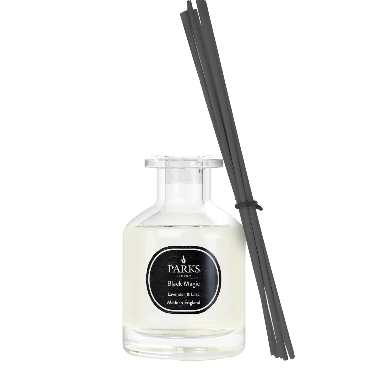 A clear glass diffuser bottle with black reeds, labeled 'PARKS Black Magic', containing a purple liquid.