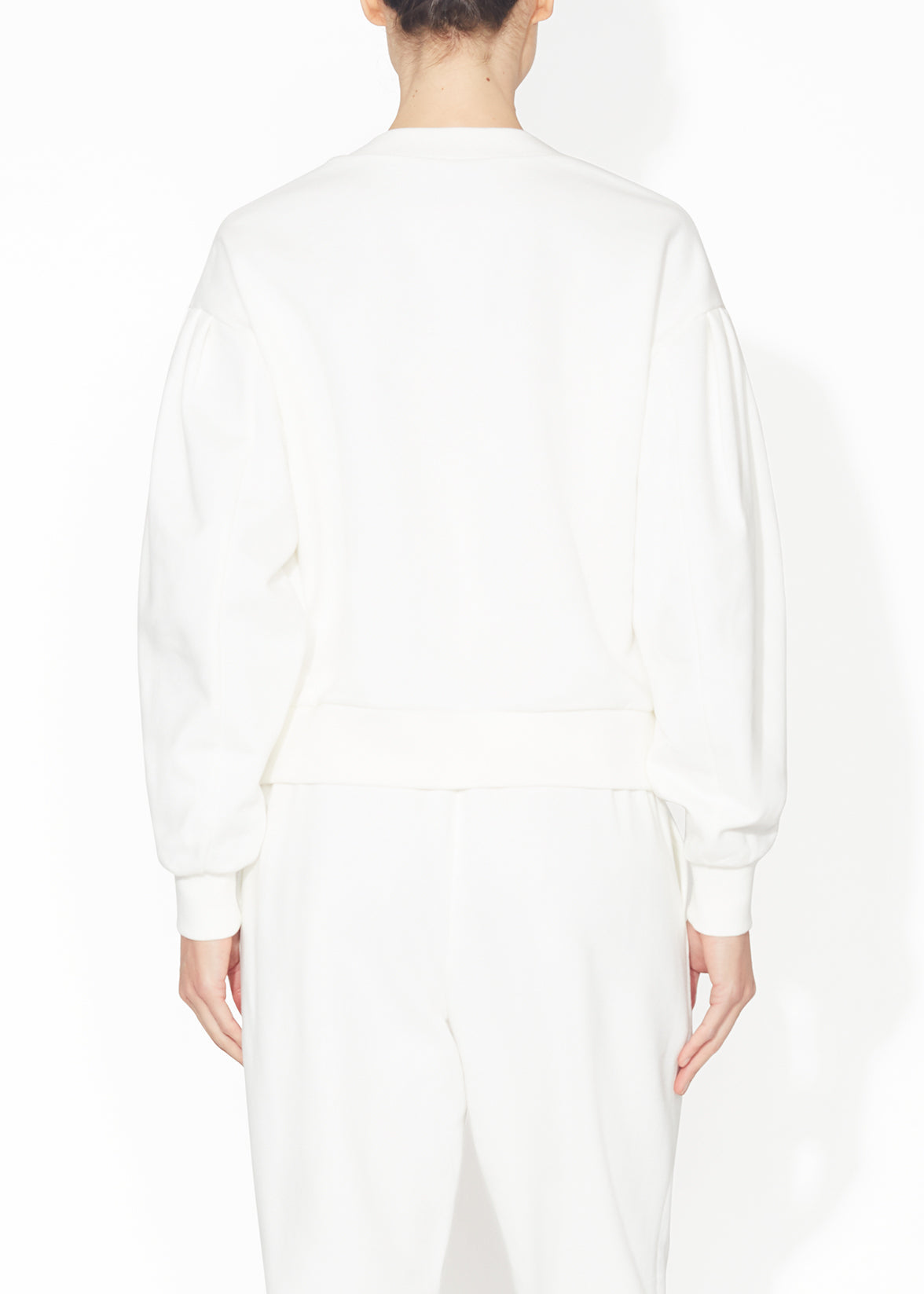 A back view of a ivory sweatshirt.