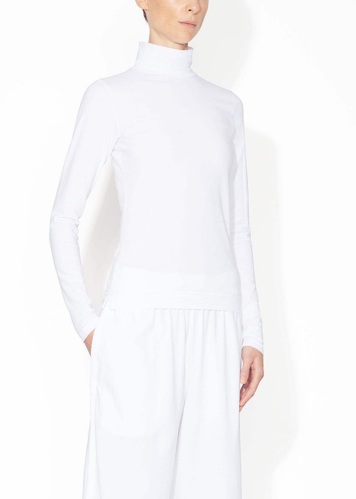 An angled view of a white turtleneck.