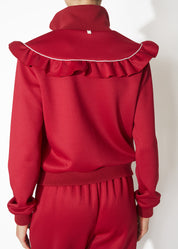 A back view of a burgundy track jacket.