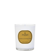 A white Parks candle with a label reading 'Sandalwood & Ylang Ylang', indicating it is made in England.