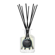 A clear glass bottle with black reeds inserted for fragrance release, labeled 'PARKS Aromatherapy' with a black and green design.