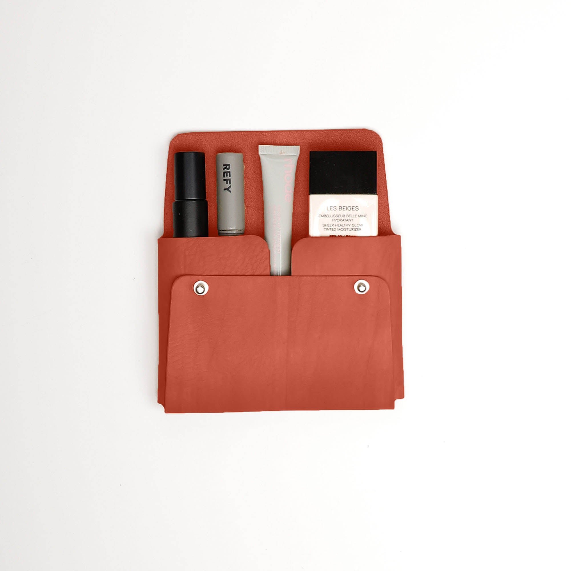 Pouch-Kuai-Burnt_Orange-Medium-Front-2-Leather_Pouch-Cocoa-Debossing-Wicker_Wings-Sustainable_Leather_Products-Upcycled_Leather-Small_Leather_Goods-Made_in_England-Leather_Accessories_cf191fff-9607-4276-8226-219a3e2e9f52.jpg