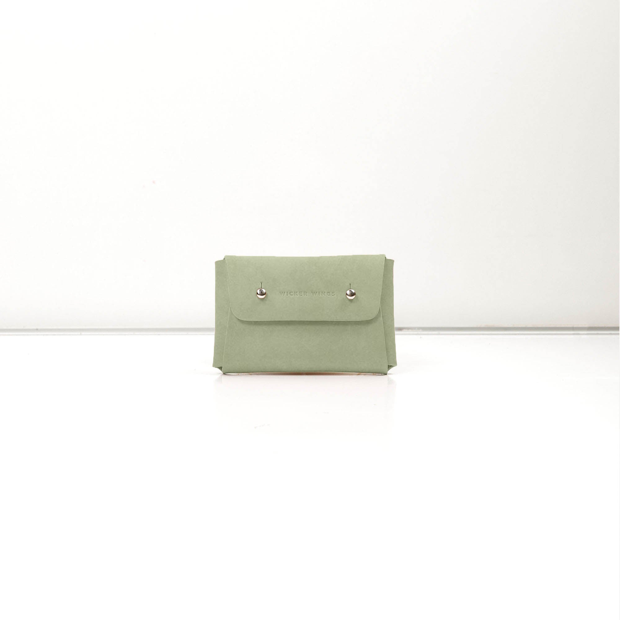 Pouch-Kuai-Sage-Small-Front-1-LeatherPouch-Cocoa-Debossing-WickerWings-SustainableLeatherProducts-UpcycledLeather-SmallLeatherGoods-MadeinEngland-LeatherAccessories-WickerBag-WickerHa.jpg