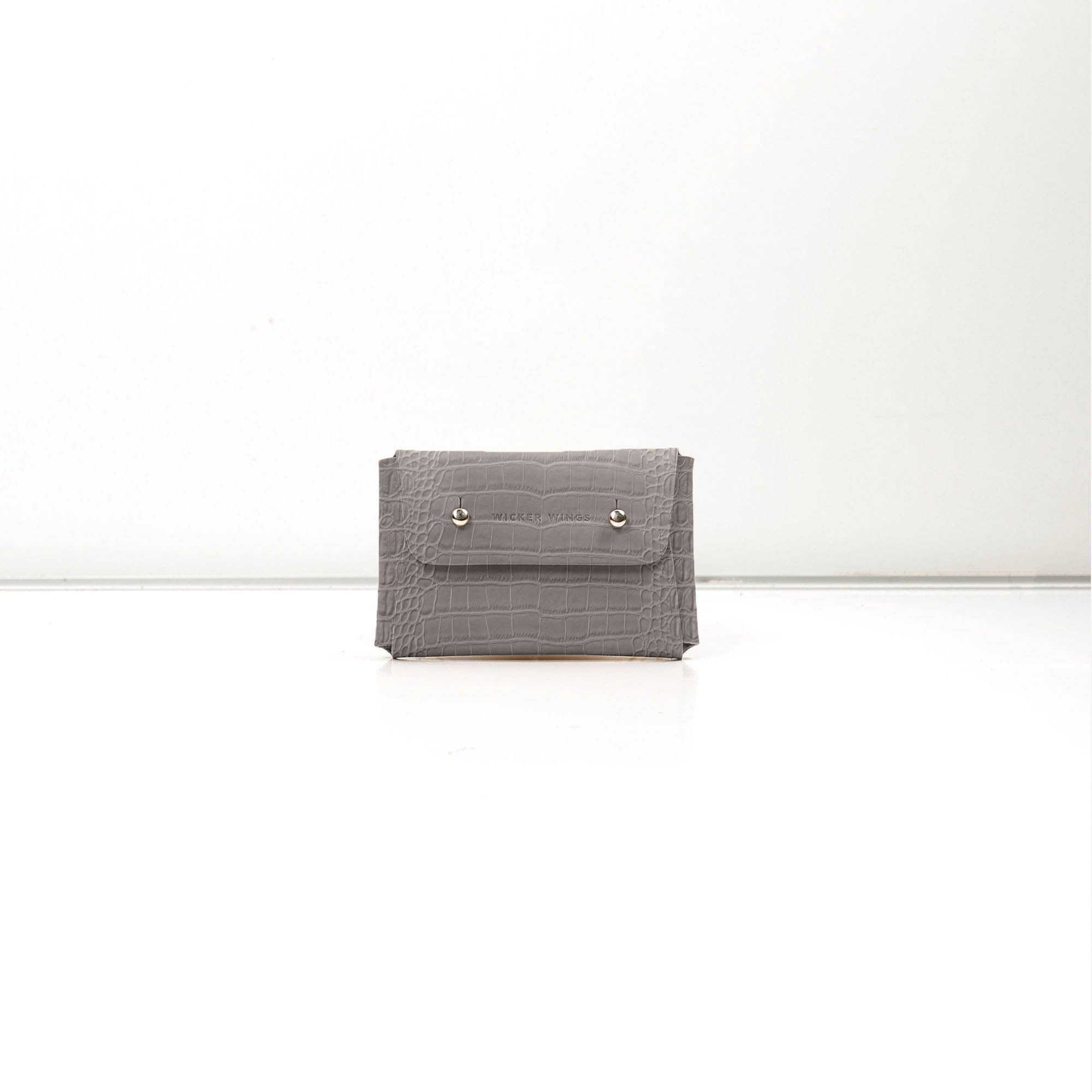 Pouch-Kuai-Small-GreyCroco-Front-1-LeatherPouch-Cocoa-Debossing-WickerWings-SustainableLeatherProducts-UpcycledLeather-SmallLeatherGoods-MadeinEngland-LeatherAccessories-WickerBag-Wic.jpg