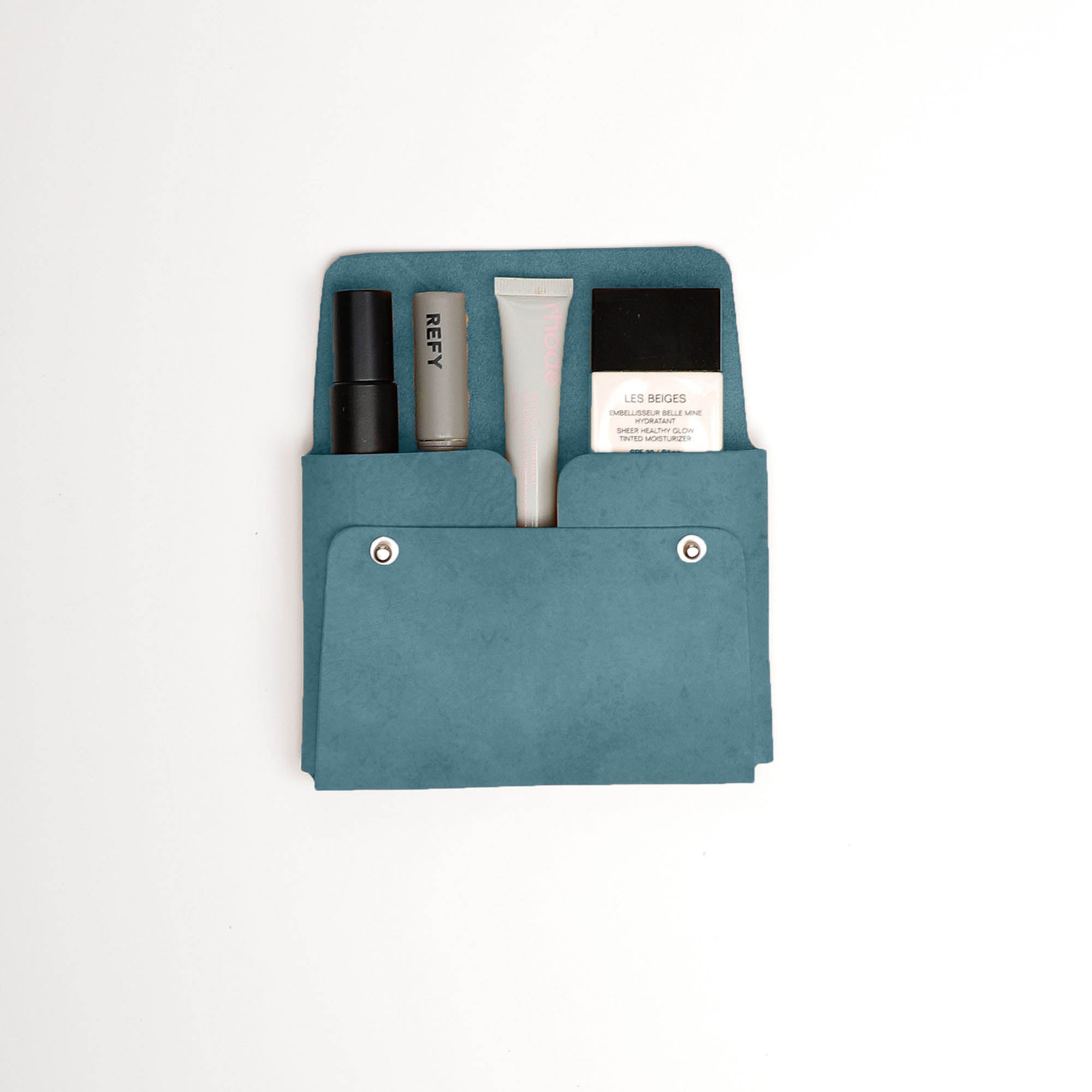 Pouch-Kuai-Teal-Medium-Front-2-Leather_Pouch-Cocoa-Debossing-Wicker_Wings-Sustainable_Leather_Products-Upcycled_Leather-Small_Leather_Goods-Made_in_England-Leather_Accessories-Wicker_29e00707-ba06-463c-93e7-2f624870c2f7.jpg