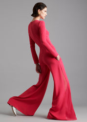 A model wearing a raspberry jumpsuit.