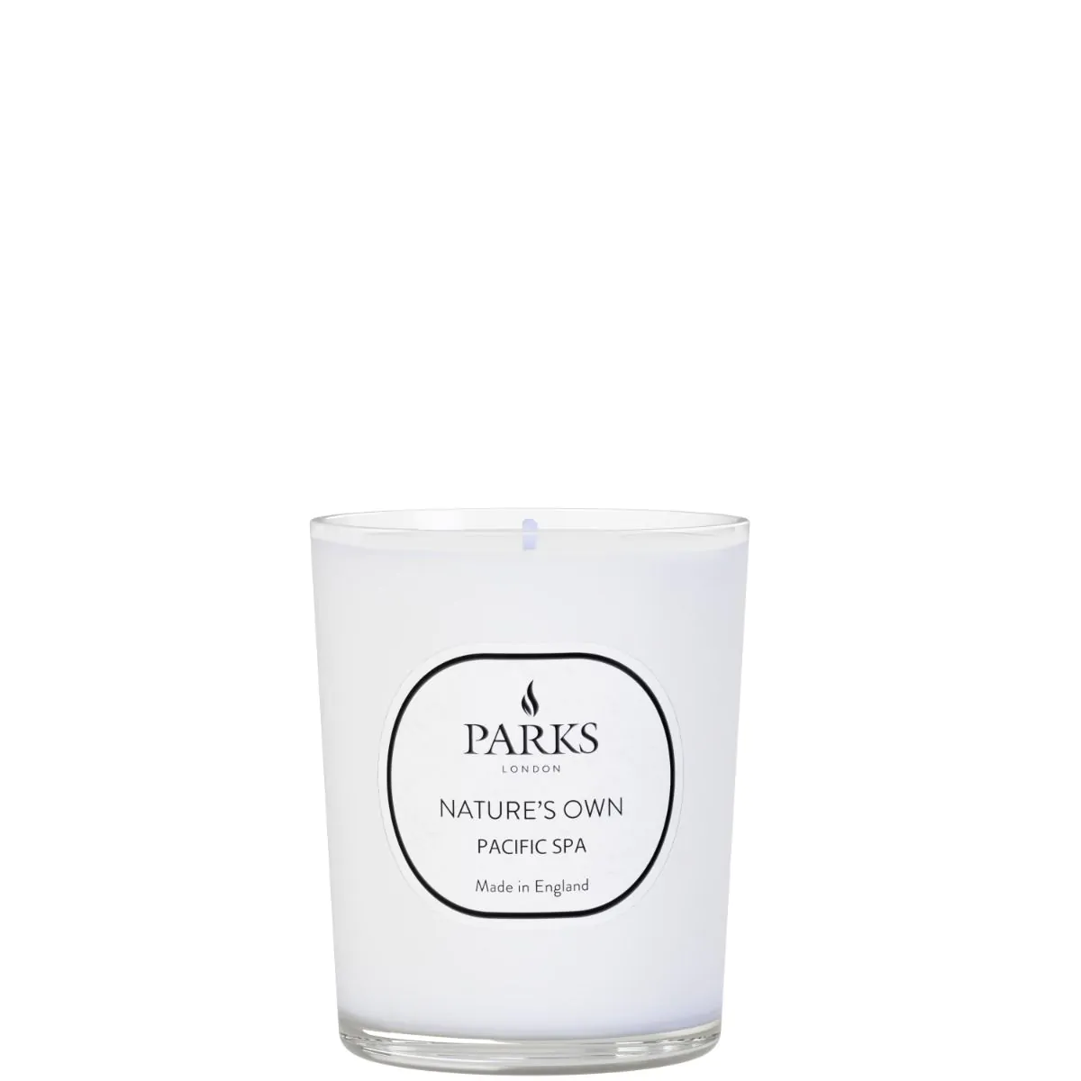 A white candle with a label that reads 'PARKS NATURE'S OWN PACIFIC SPA' and 'Made in England' on the front.