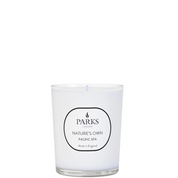 A white candle with a label that reads 'PARKS NATURE'S OWN PACIFIC SPA' and 'Made in England' on the front.