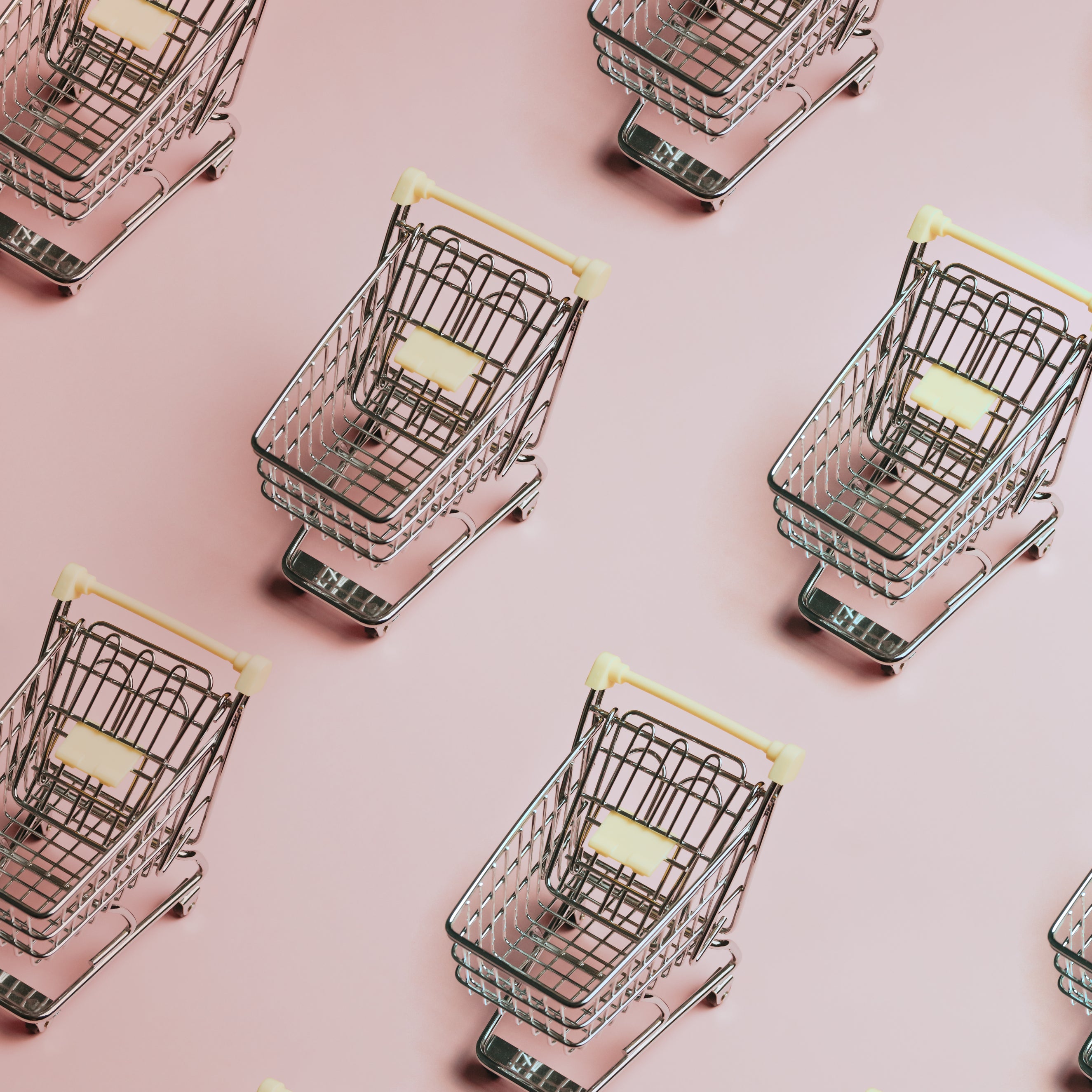 pattern-of-silver-shopping-carts-on-a-pink-background.jpg