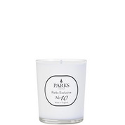 A white candle with a label reading 'PARKS Exclusive No10' in a clear glass vessel.
